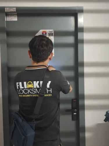 Locksmith working on a door