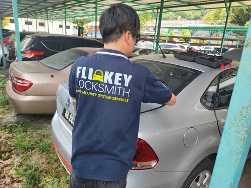 Locksmith working on a car door