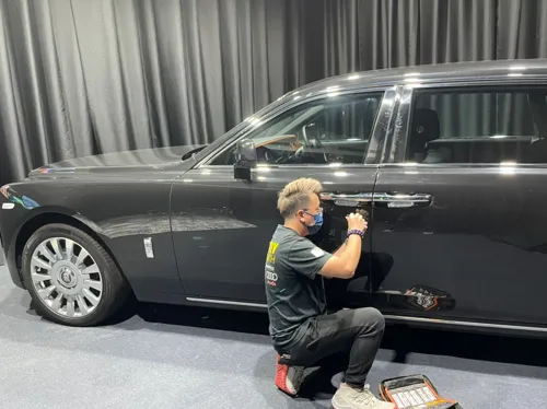 Locksmith working on a car door