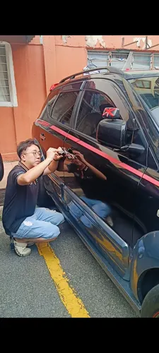 Locksmith working on a car door